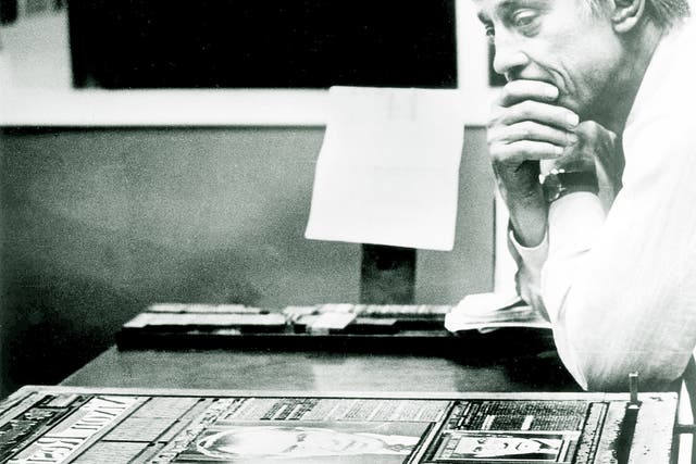 Ben Bradlee in the composing room of The Washington Post in 1974, looking at A1 of the first edition of the newspaper, headlined 'Nixon Resigns'.
