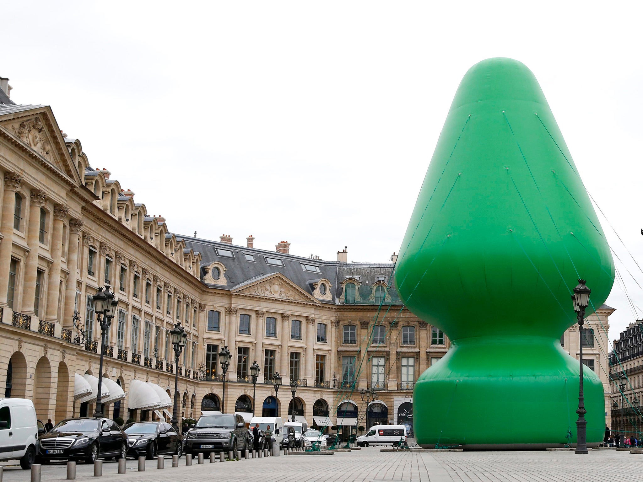 A sculpture entitled 'Tree' by US artist Paul McCarthy is on display at the Place Vendome in Paris, France, 16 October 2014. The 24.4 meter high piece is shown publicly as part of Paul McCarthy's exhibition 'Chocolate Factory' held at the Monnaie de Paris