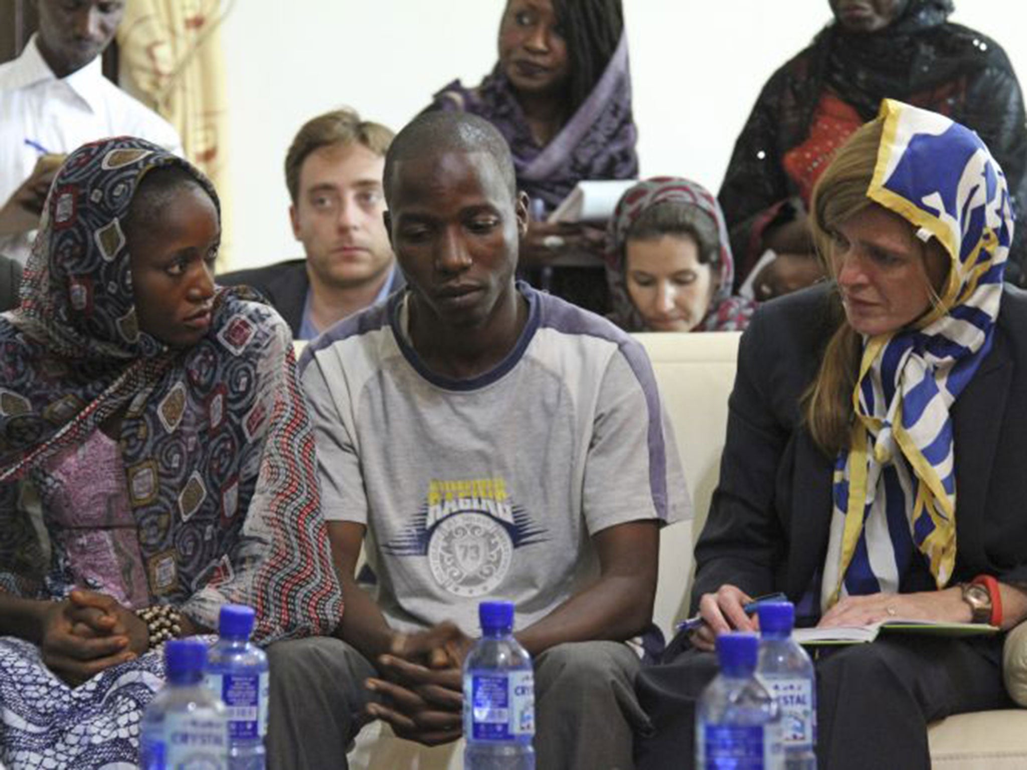 U.S. Ambassador to the United Nations, Samantha Power, right meets with Ebola survivors in Conakry, Guinea