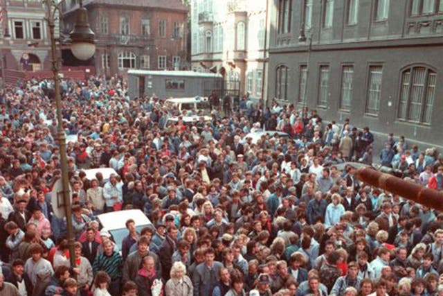 East German refugees outside the West German embassy in Prague in October 1989 waiting to take a train for the West 