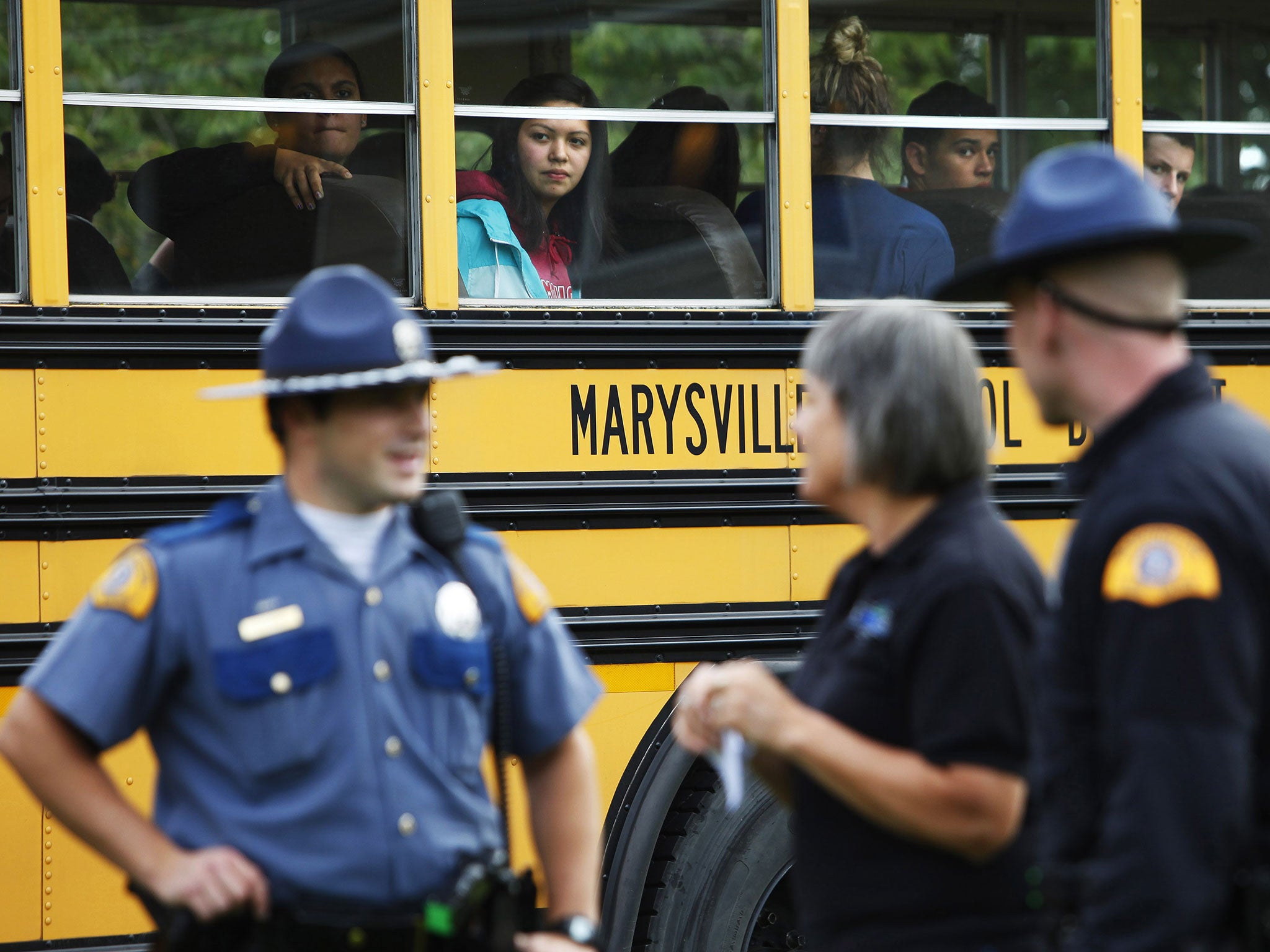 Marysville-Pilchuck students are bussed from the high school after a school shooting took place Friday, Oct. 24, 2014