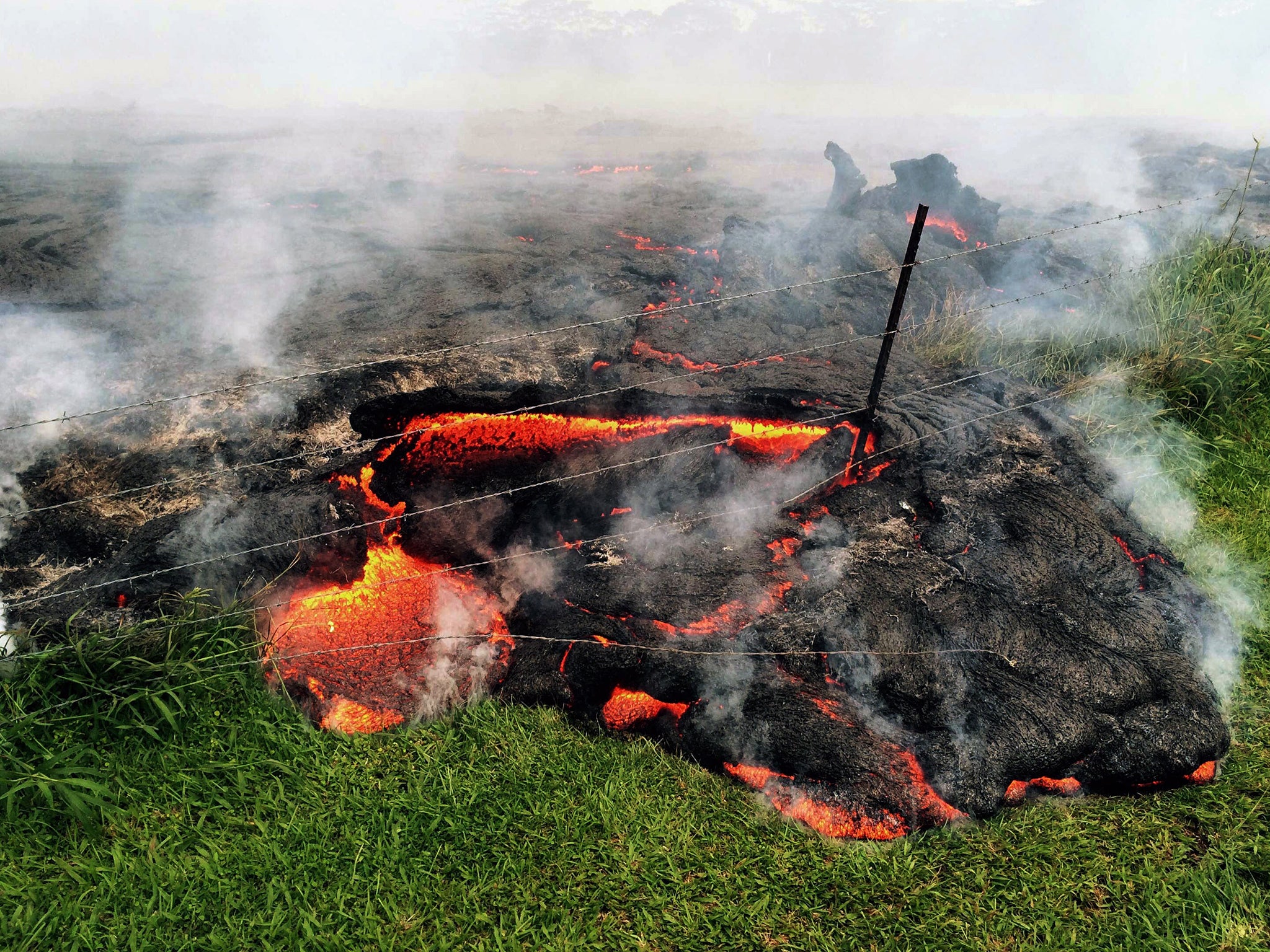 Lava flow advancing across the pasture between the Pahoa cemetery and Apaa Street