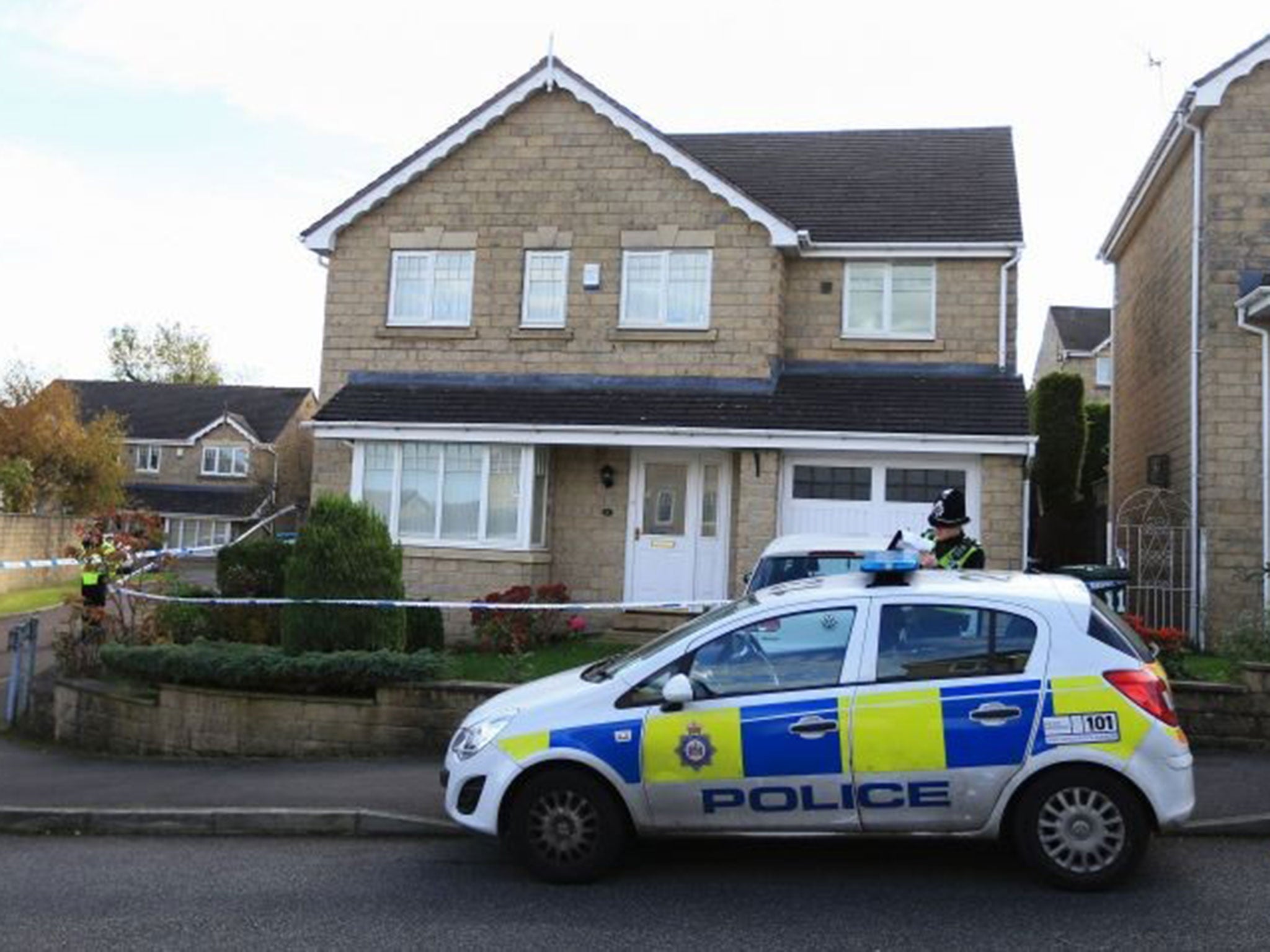 Police attend the scene in the Clayton area of Bradford, after four people were found dead