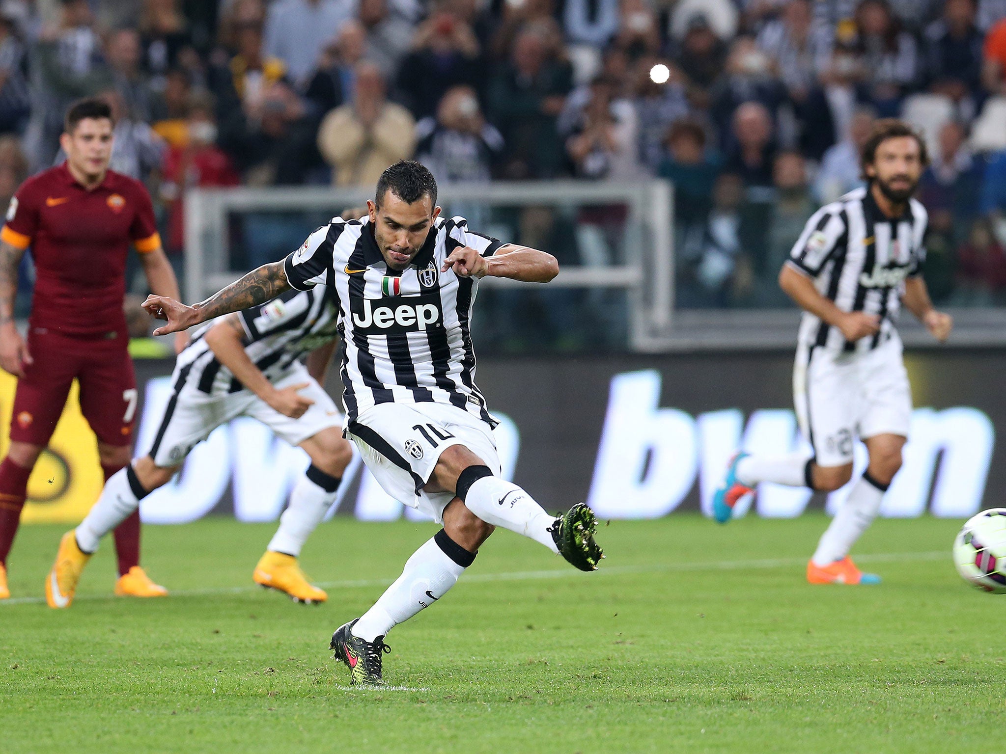 Carlos Tevez in action for Juventus against Roma