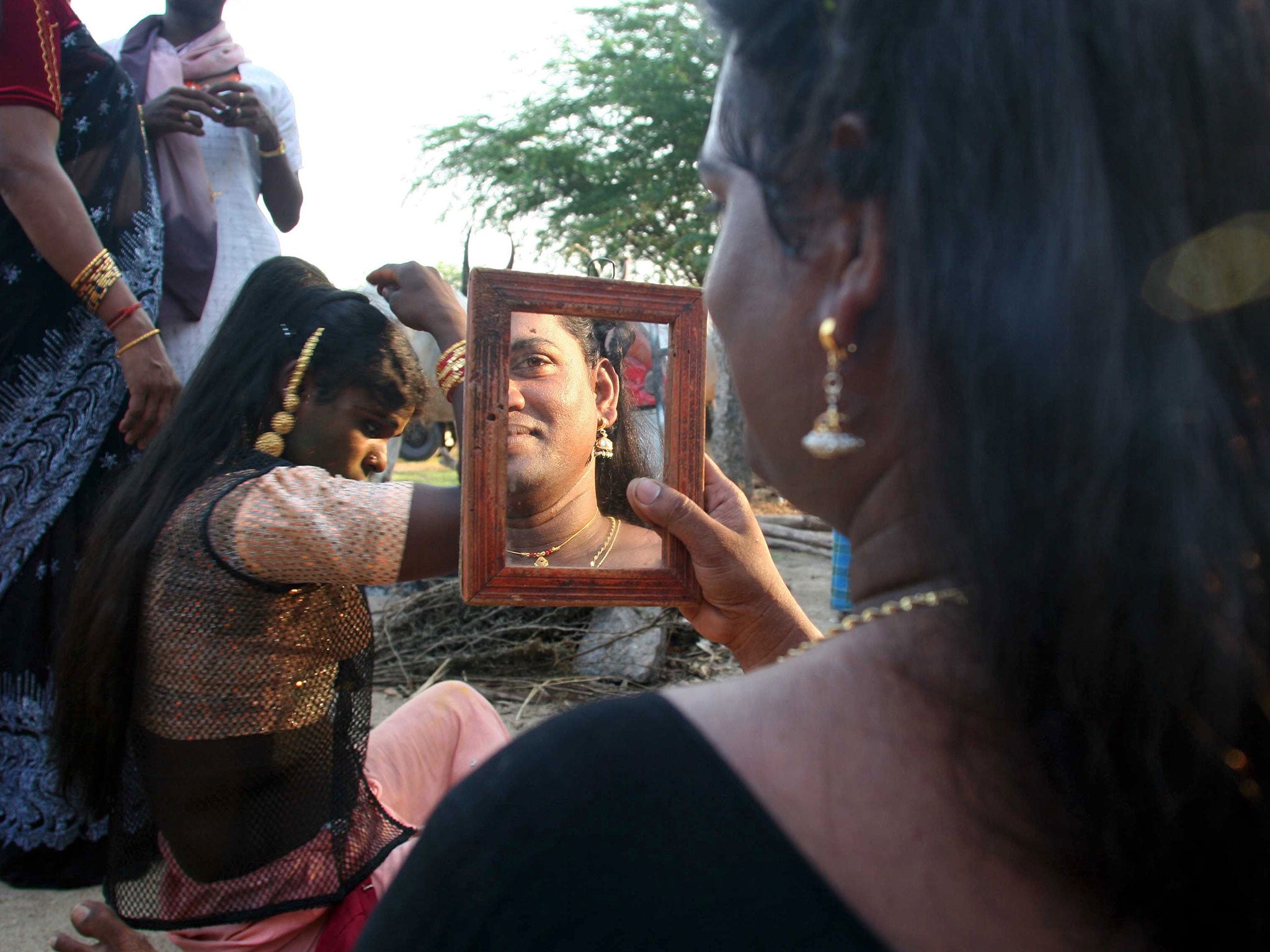 Hijras (not involved in the riots) prepare for their annual festival