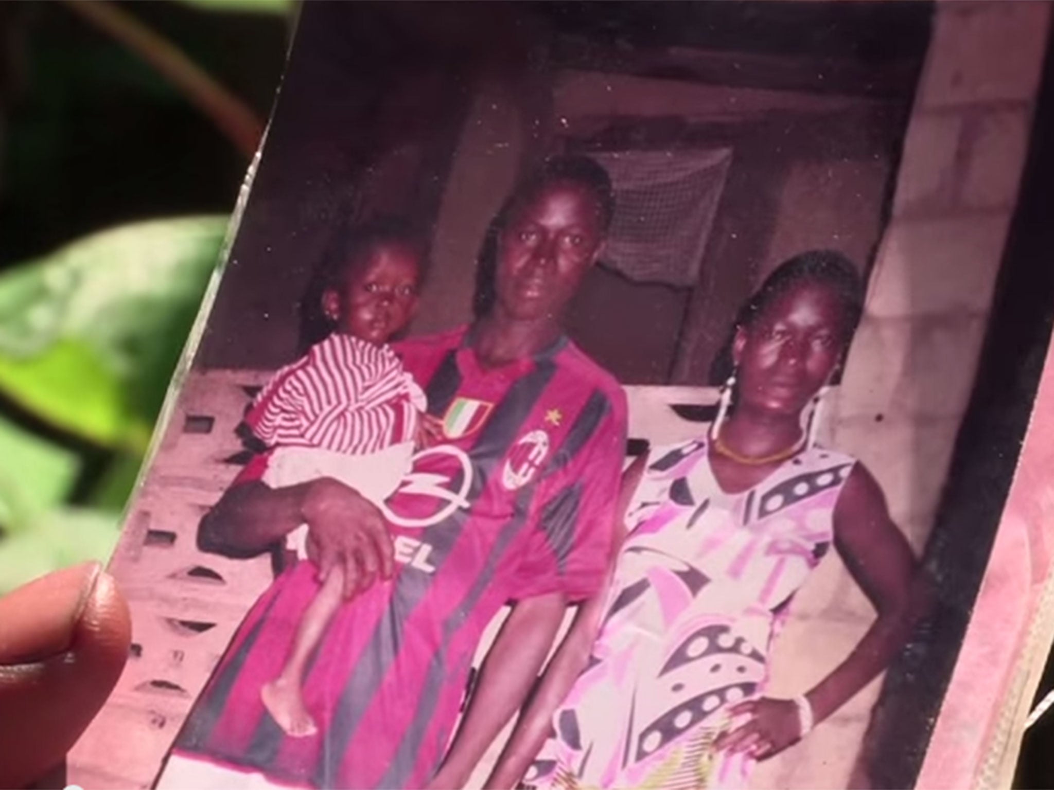 Etienne Ouamouno poses alongside his wife while holding one of their children, believed to be Emile's sister Philomène