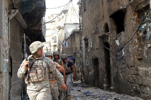 Lebanese soldiers patrol in the Bab al-Tabbaneh area of Tripoli