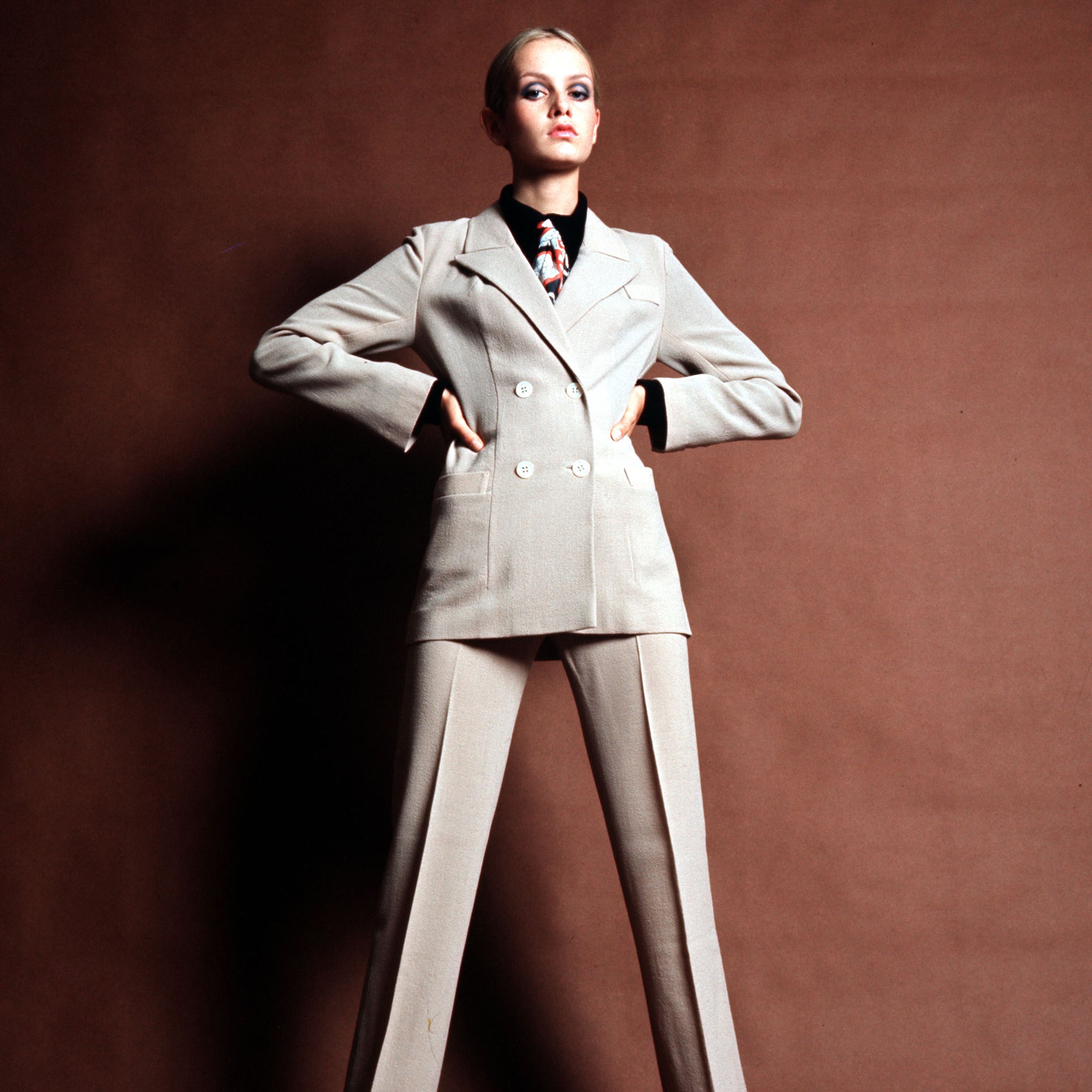 England, 1968, British model Twiggy is pictured in a cream trouser suit