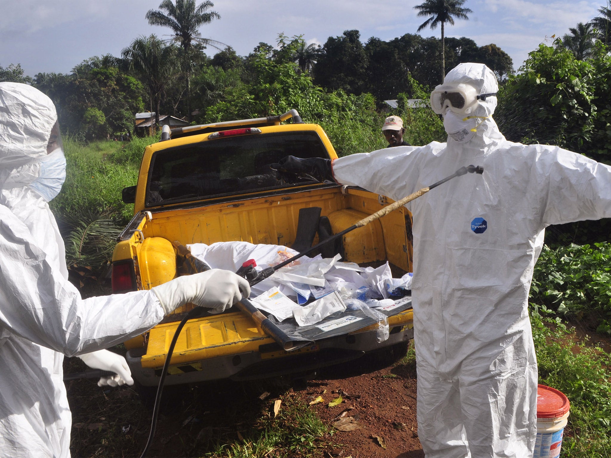 A health worker sprays disinfectant onto a college in Monrovia, Liberia