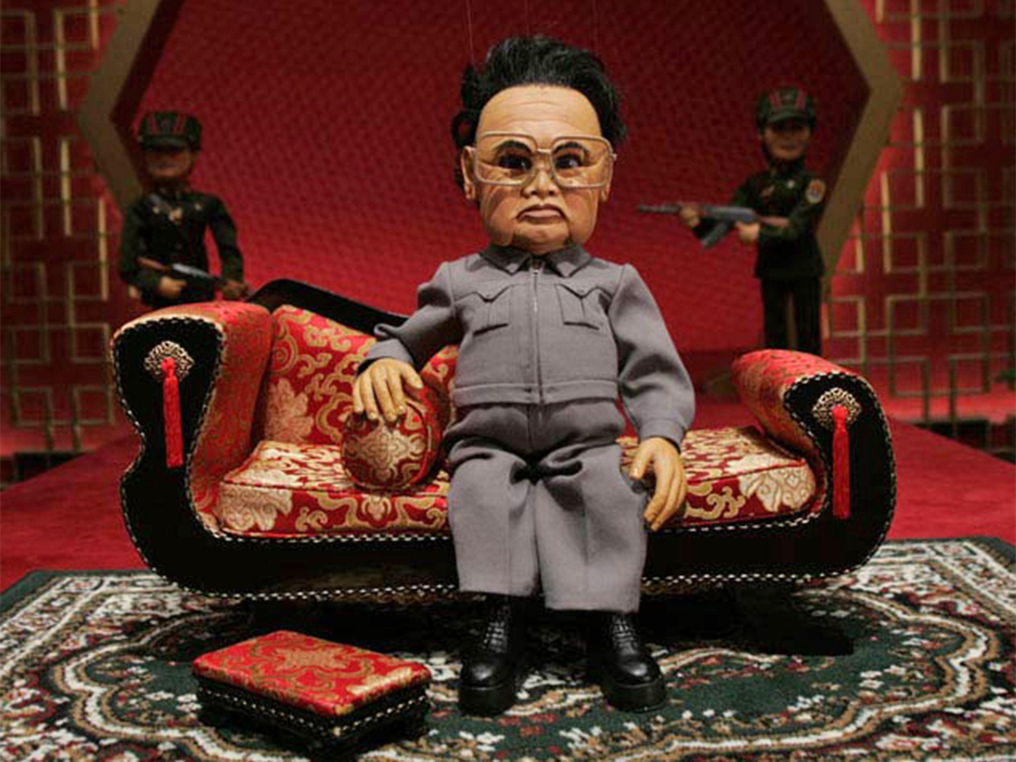 A scene from 'Team America: World Police' featuring a puppet depicting Kim Jong-Il