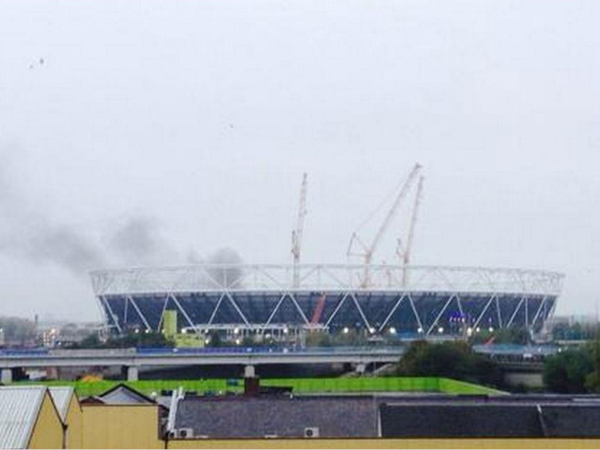 Smoke could be seen rising from the Olympic Stadium. Photo: Adam Rivers