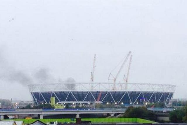 Smoke could be seen rising from the Olympic Stadium. Photo: Adam Rivers