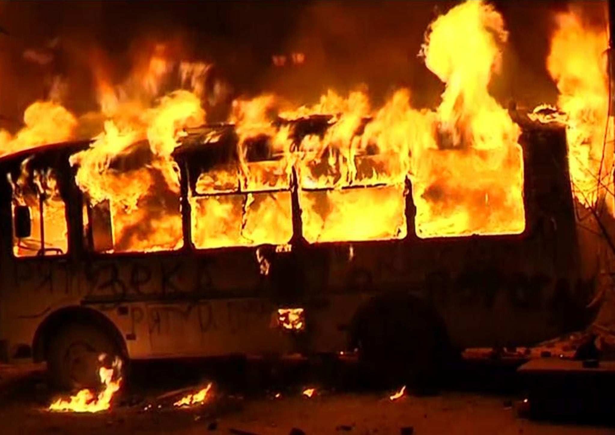 A bus catches fire amid this year's violent protests in Kiev