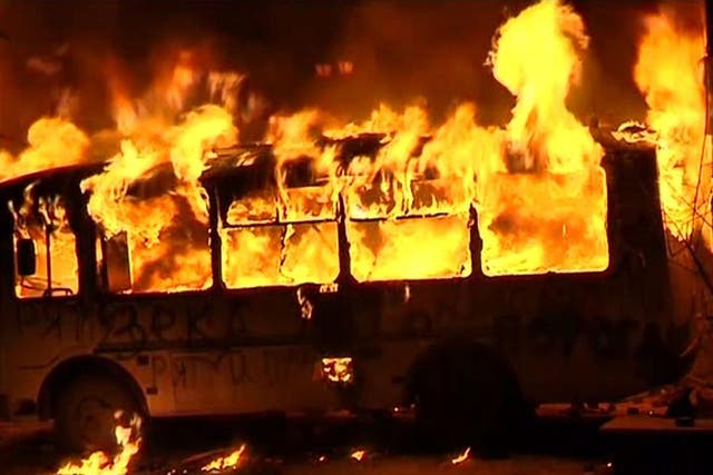 A bus catches fire amid this year's violent protests in Kiev