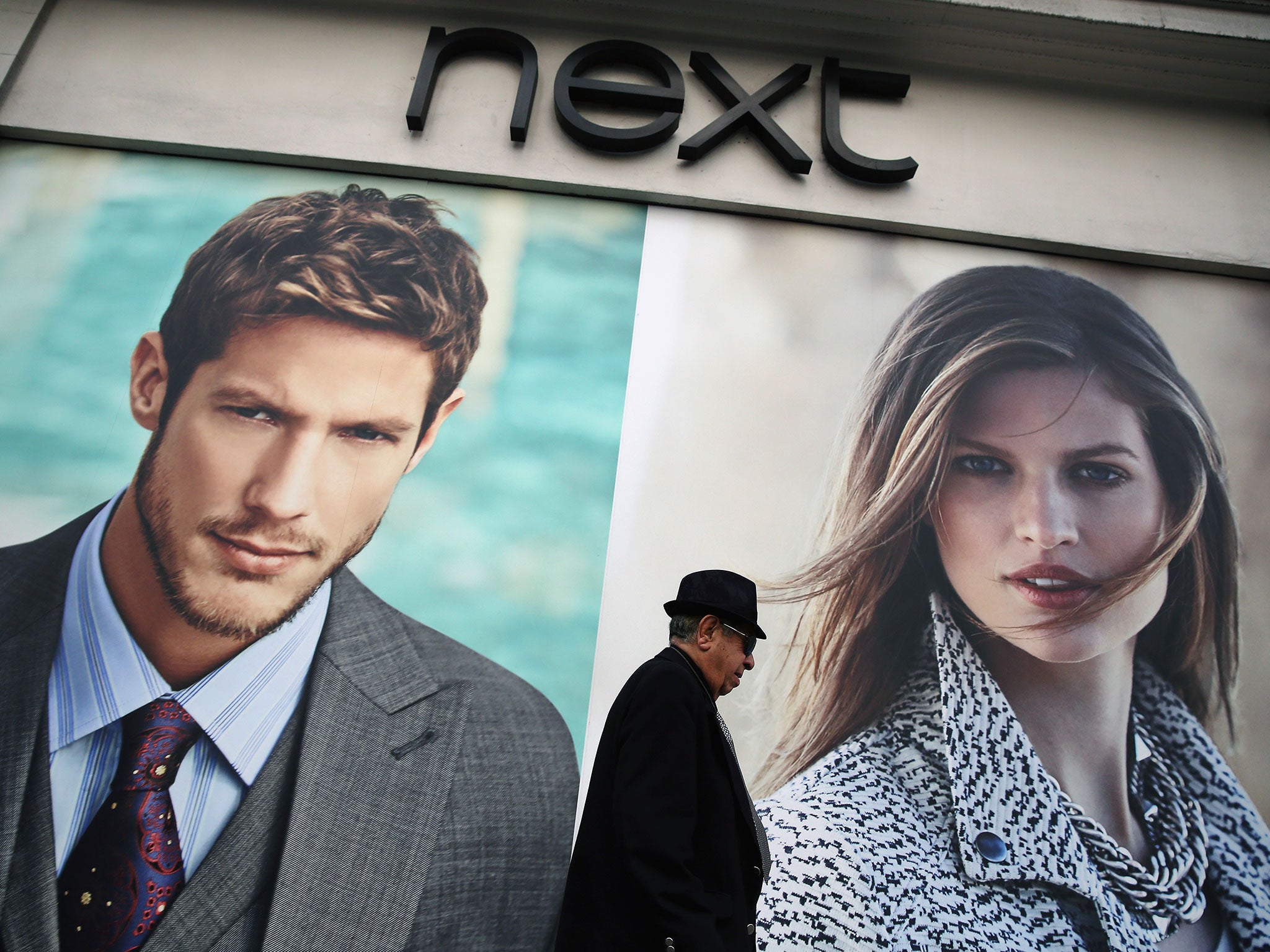A man walks past a Next store on Oxford Street on June 3, 2014 in London, England.
