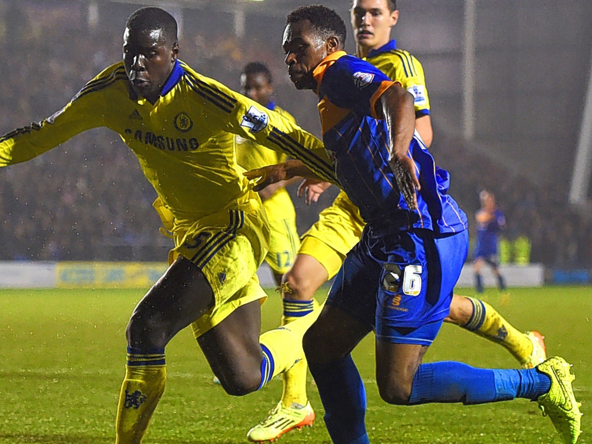Kurt Zouma, of Chelsea, keeps Shrewsbury’s Jean-Louis Akpa Akpro (right) in check during an impressive performance from Jose Mourinho’s fringe playe