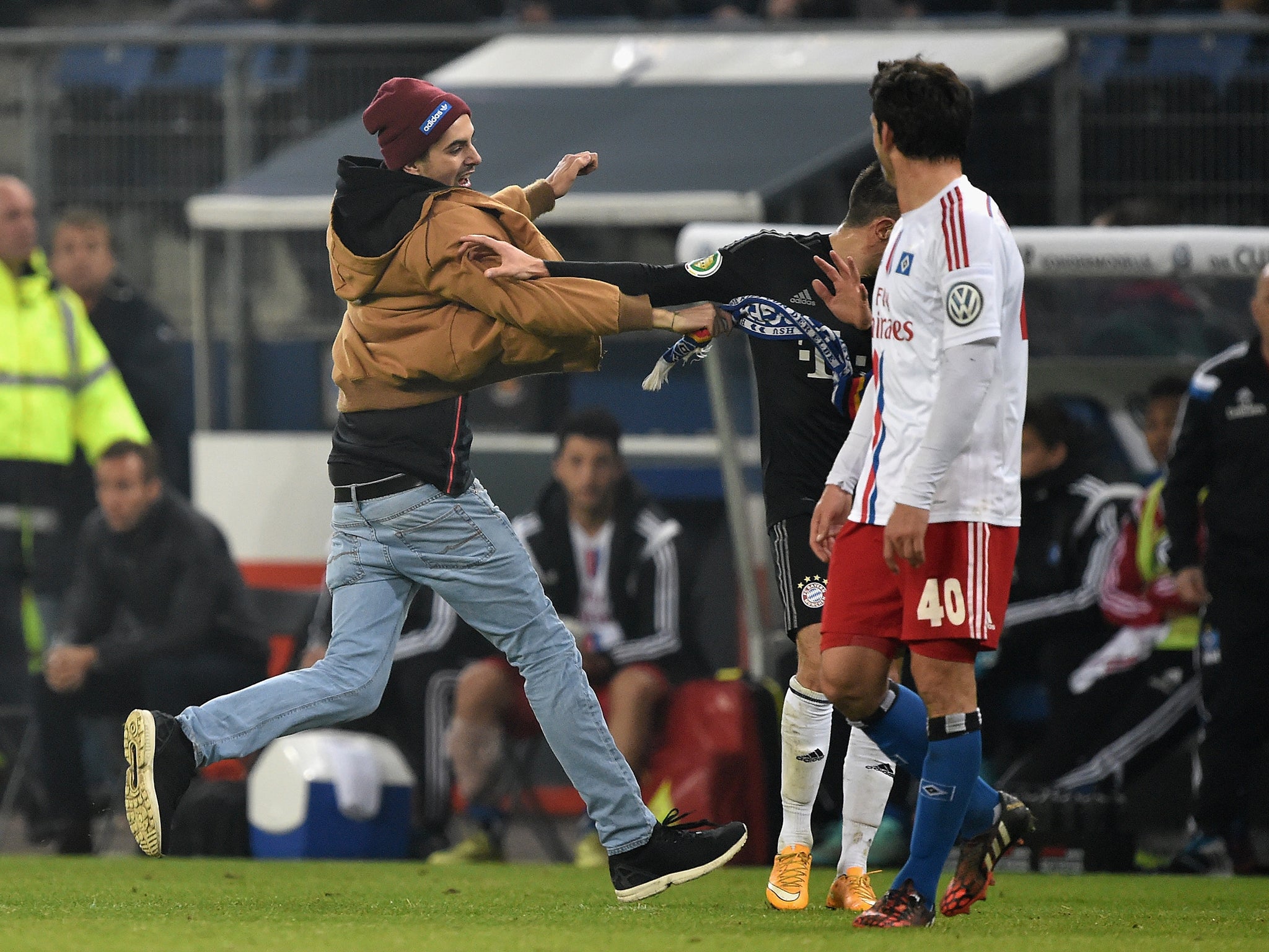 Franck Ribery is struck by a pitch invader
