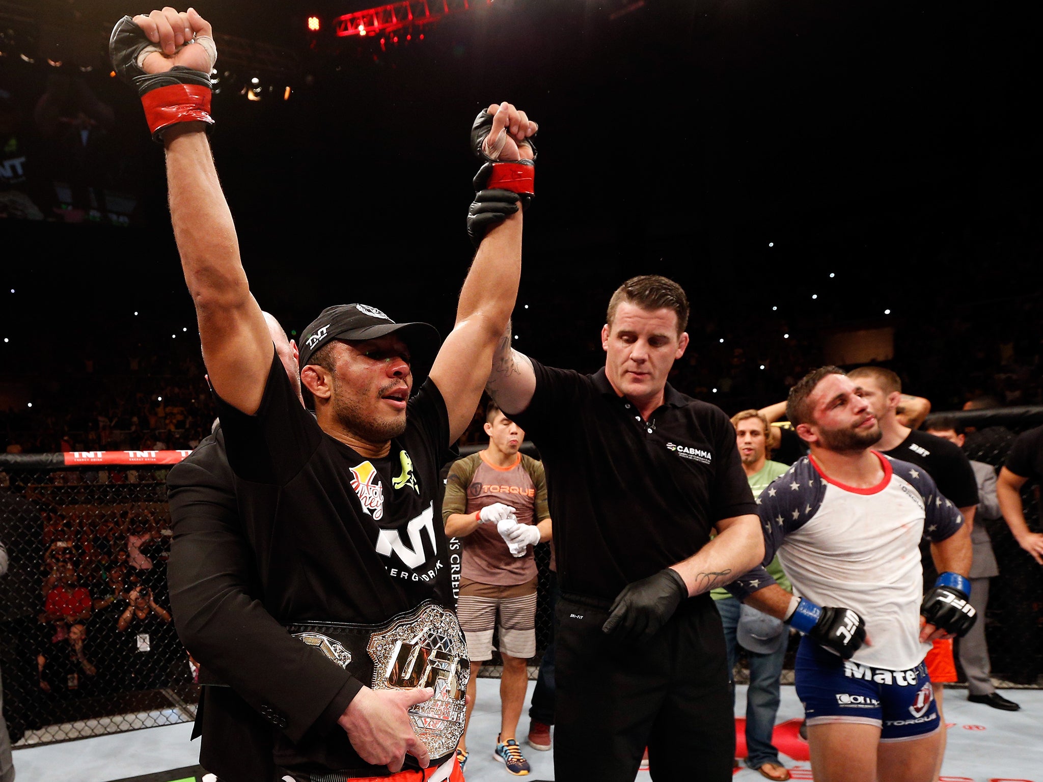 Jose Aldo celebrates after his unanimous decision victory at UFC 179