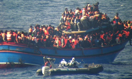 A crowded boat of rescued African migrants off the coast of Sicily