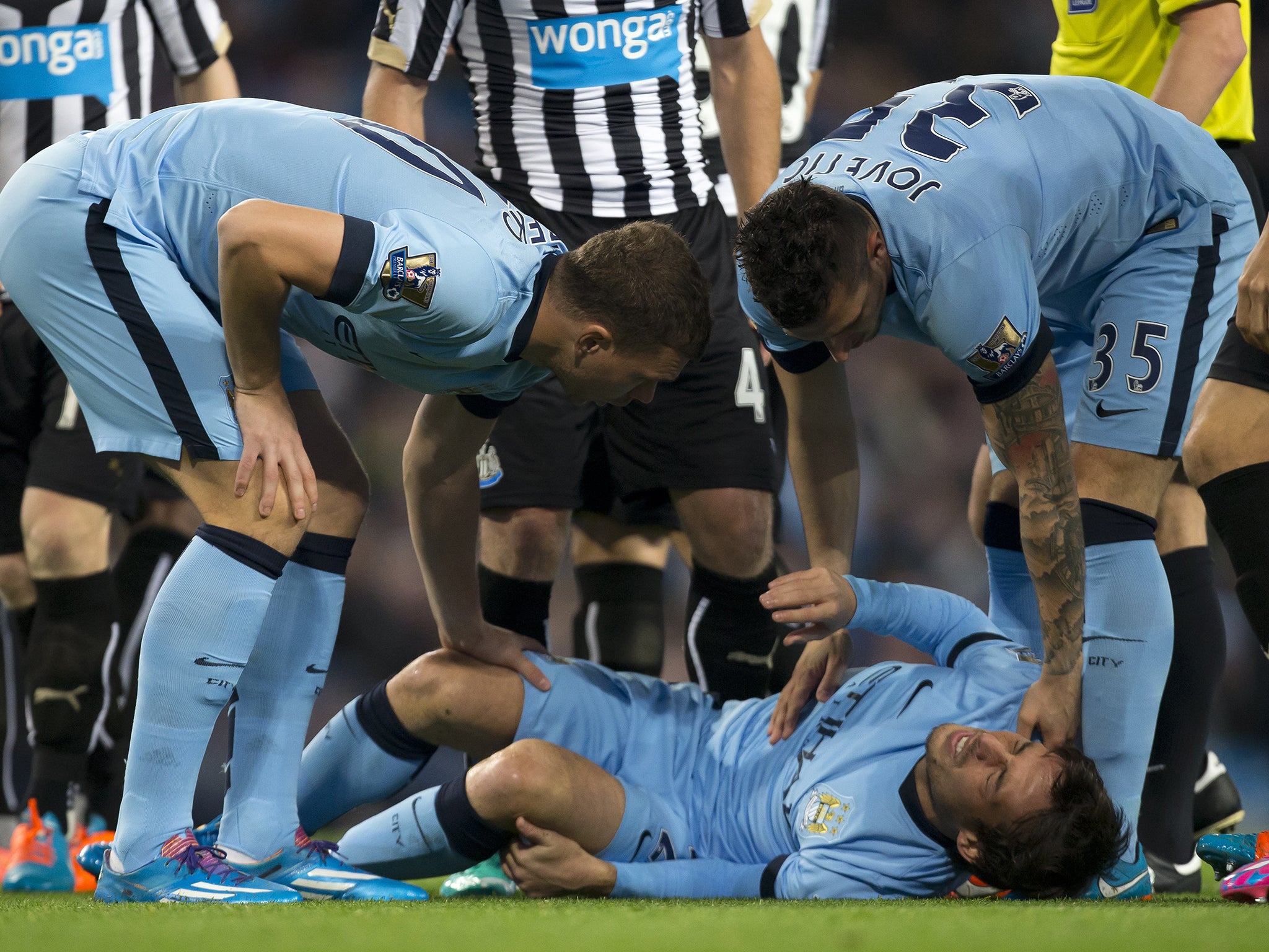 David Silva is forced to limp off against Newcastle