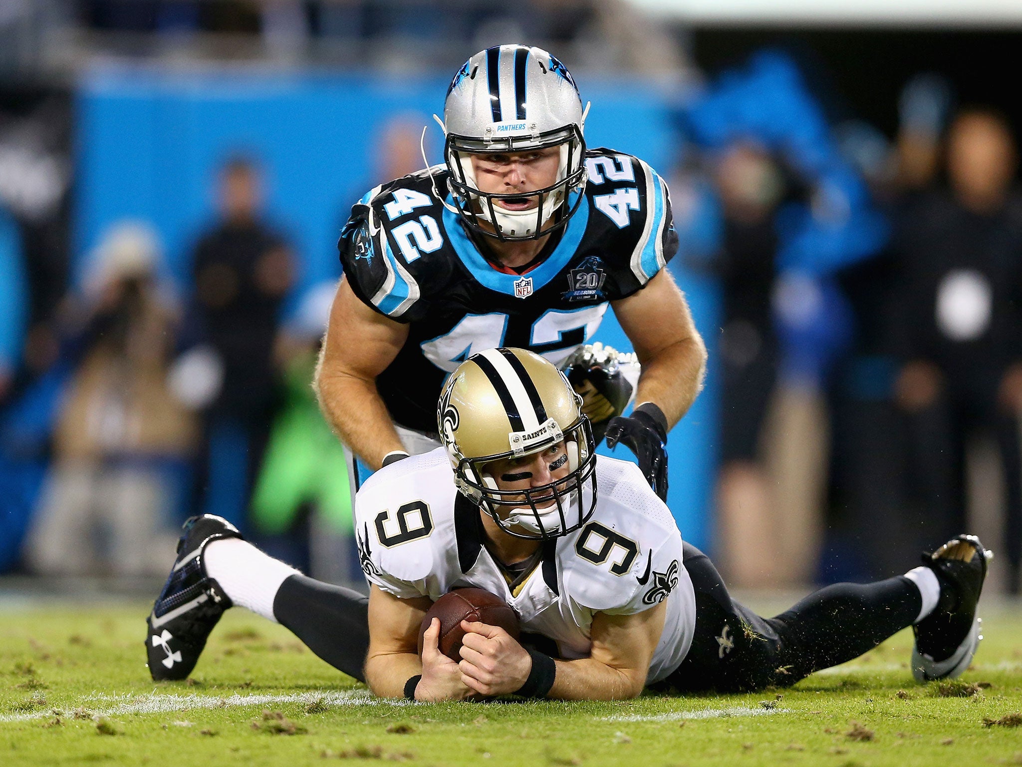 Colin Jones sacks Drew Brees for a loss