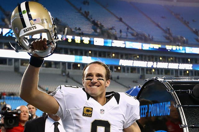 Drew Brees celebrates the 28-10 victory over the Carolina Panthers