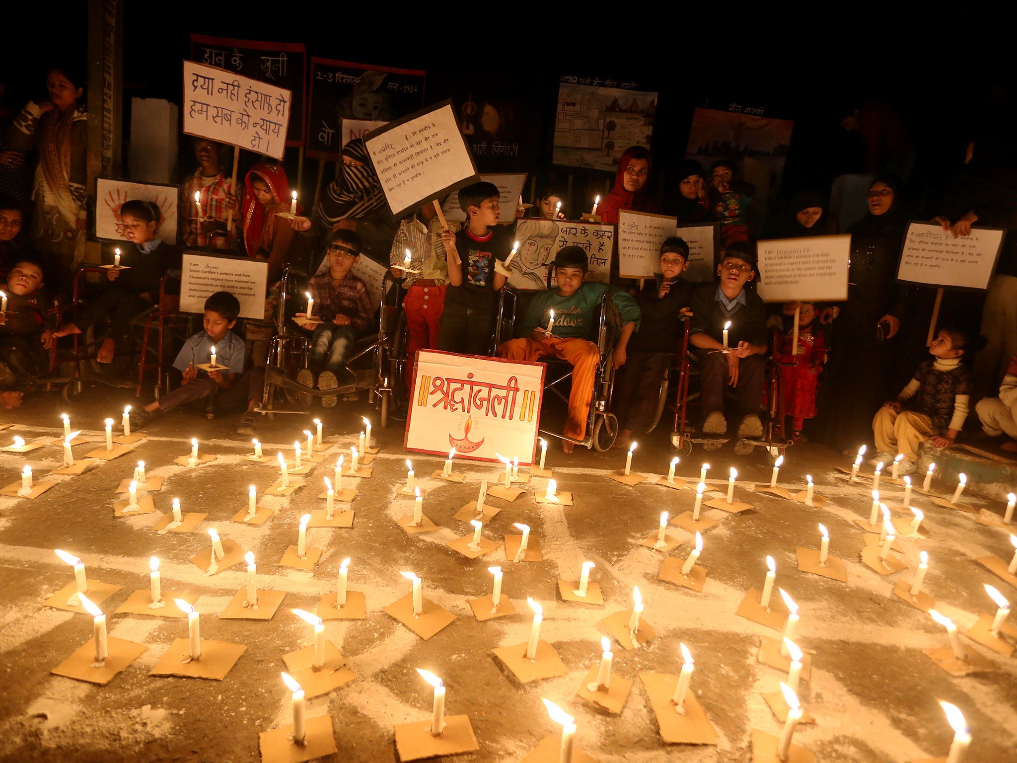 Indian children born with congenital disease, second generation victims of the1984 Bhopal gas tragedy, participate in a candle light vigil