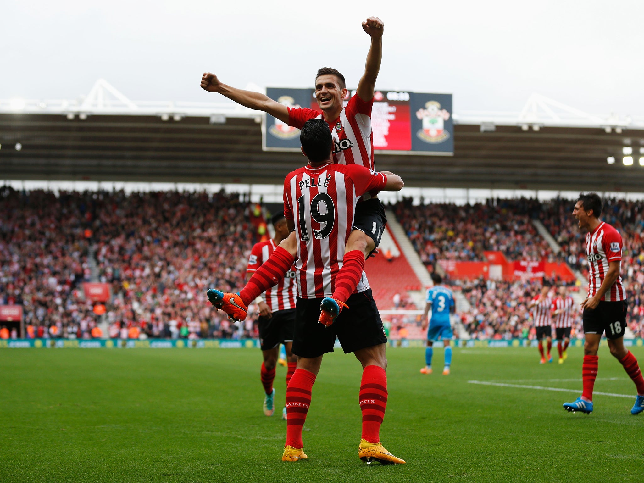 Dusan Tadic celebrates his goal with Graziano Pelle during Southampton’s rout of Sunderland