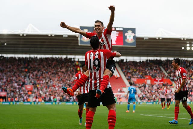 Dusan Tadic celebrates his goal with Graziano Pelle during Southampton’s rout of Sunderland
