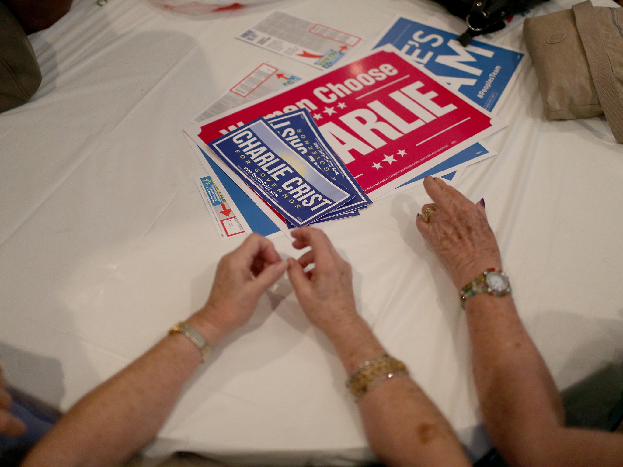 People attend a campaign event for former Florida Governor and now Democratic gubernatorial candidate Charlie Crist