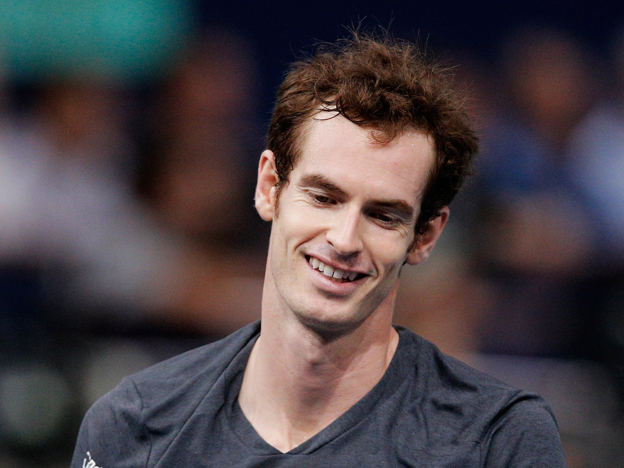Andy Murray of Great Britain smiles in his quarterfinal match against Novak Djokovic