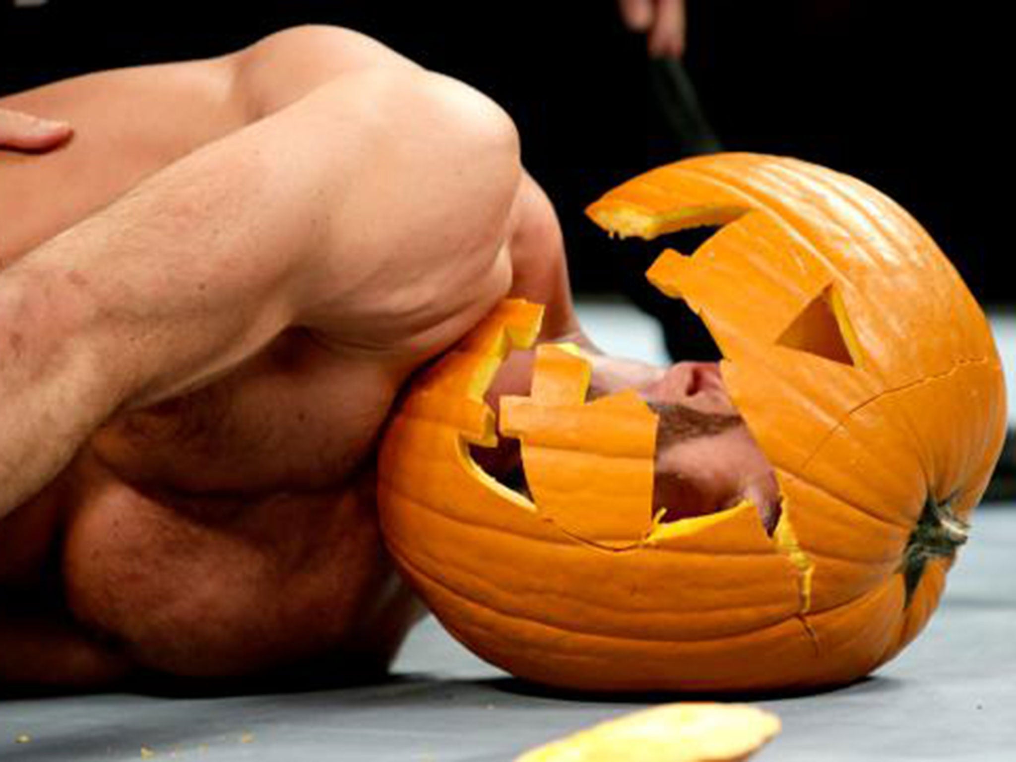 Antonio Cesaro lies prone on the canvas after Ambrose hits dirty deeds on him via a smashed pumpkin