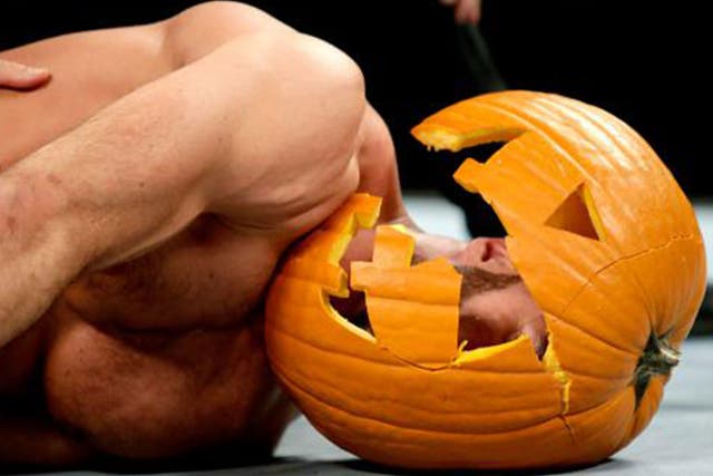 Antonio Cesaro lies prone on the canvas after Ambrose hits dirty deeds on him via a smashed pumpkin