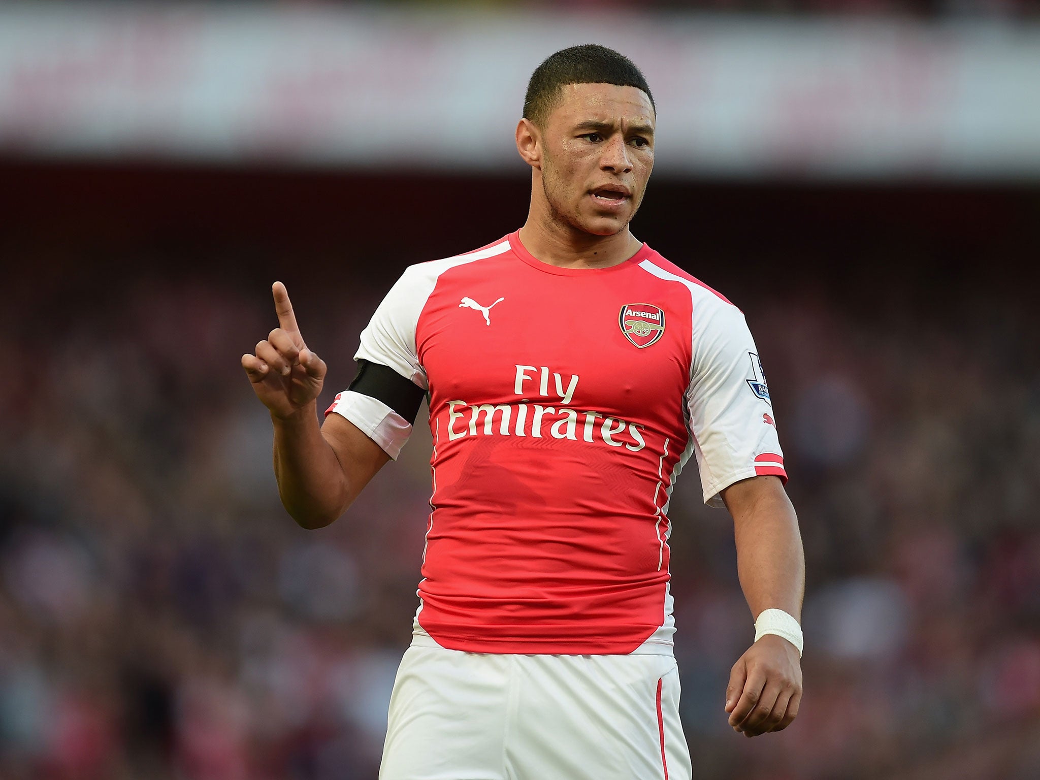 Alex Oxlade-Chamberlain gestures during the match against Burnley