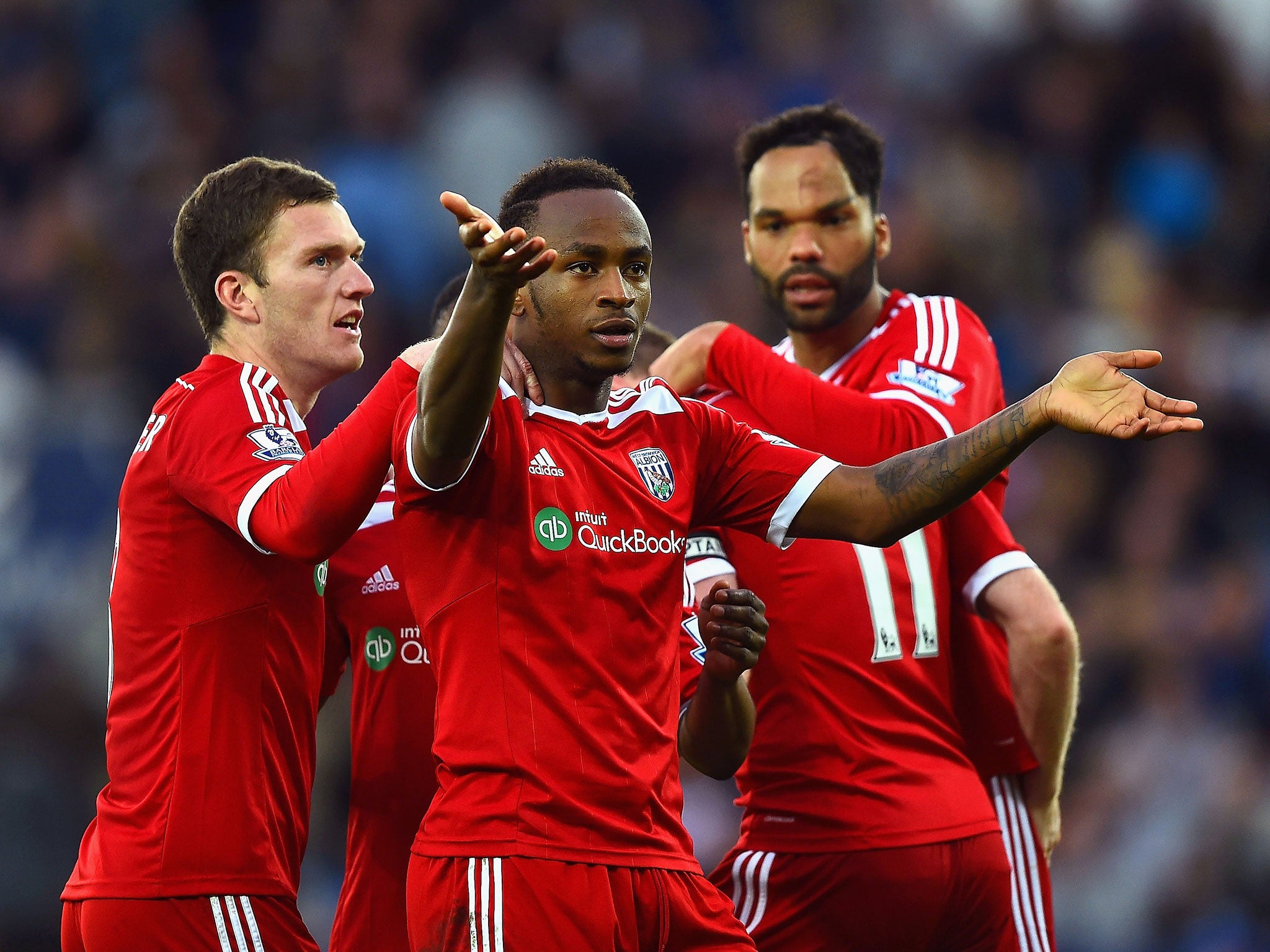 Saido Berahino celebrates Esteban Cambiasso's own goal that gave West Brom the lead