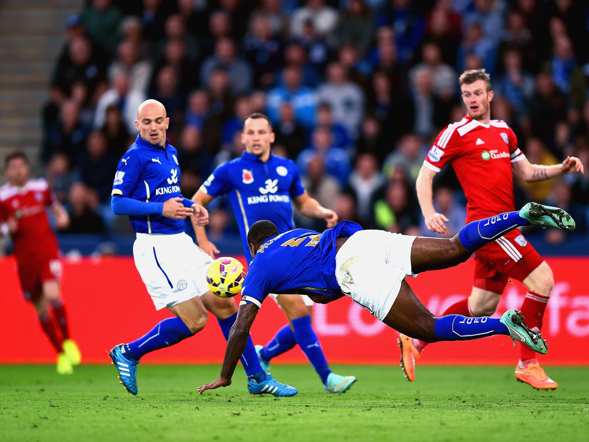 Wes Morgan heads the ball that deflects off Esteban Cambiasso and into the back of the net