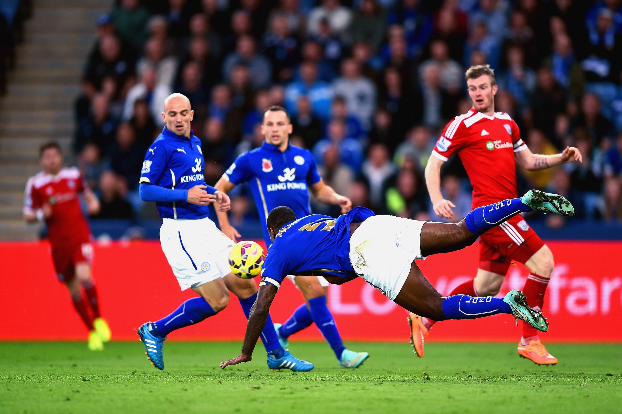 The ball cannons off Esteban Cambiasso and into the Leicester net