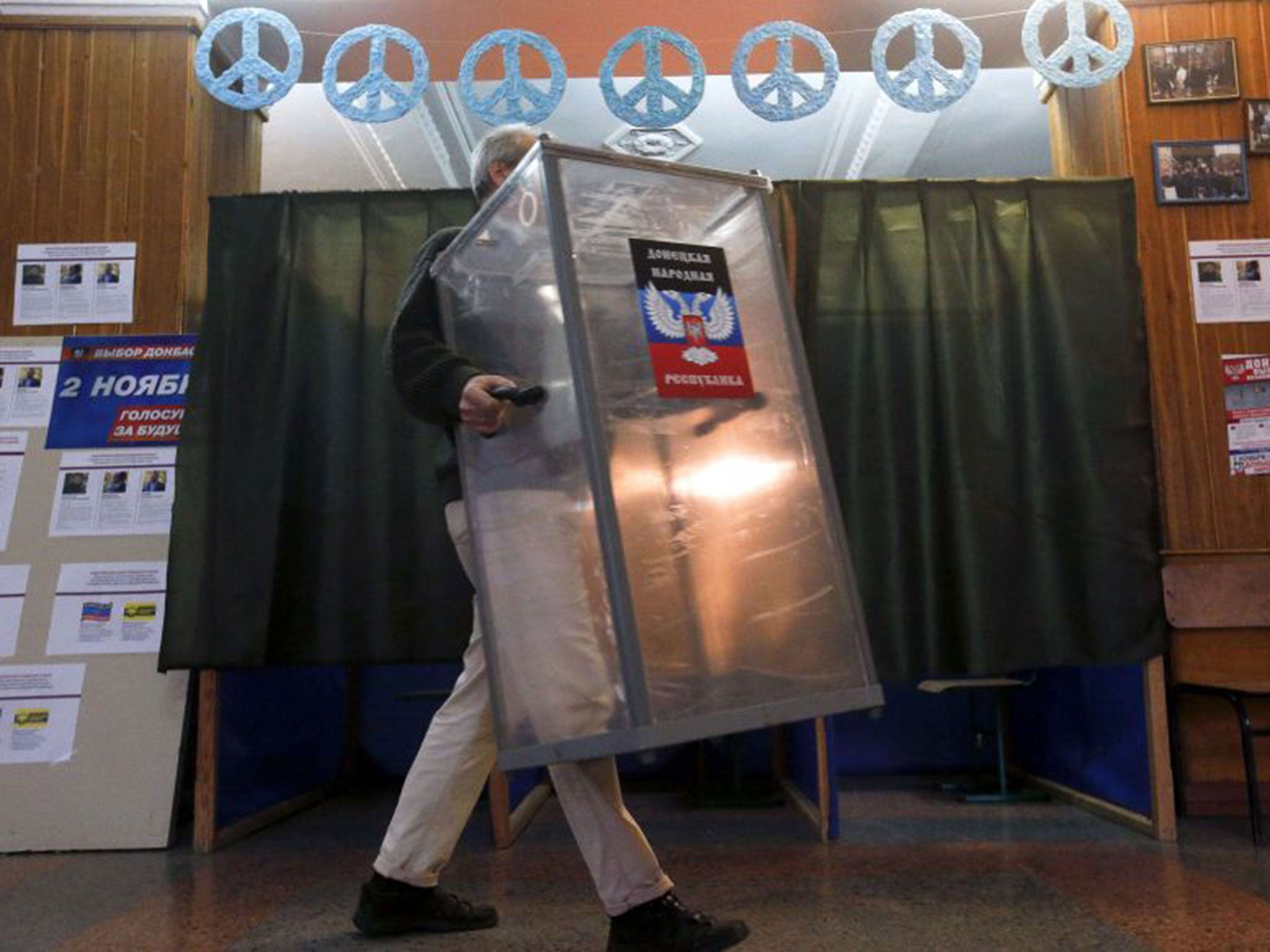Preparing for today’s election at a polling station in Donetsk