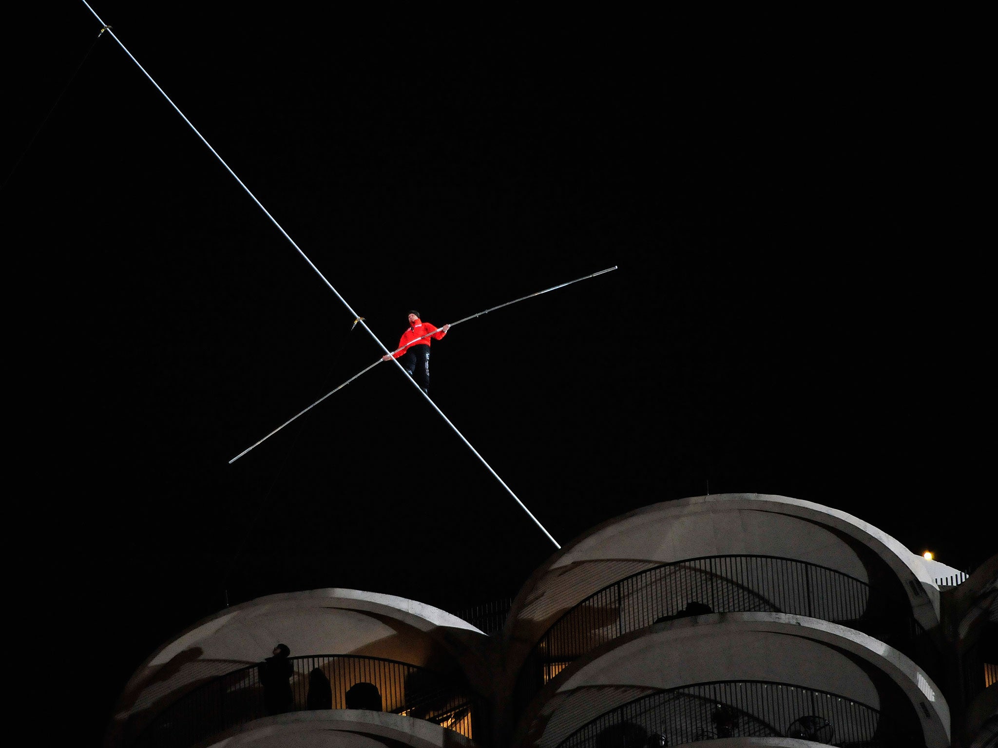 Daredevil Nik Wallenda walks a tightrope between buildings on November 2, 2014 in Chicago, Illinois.