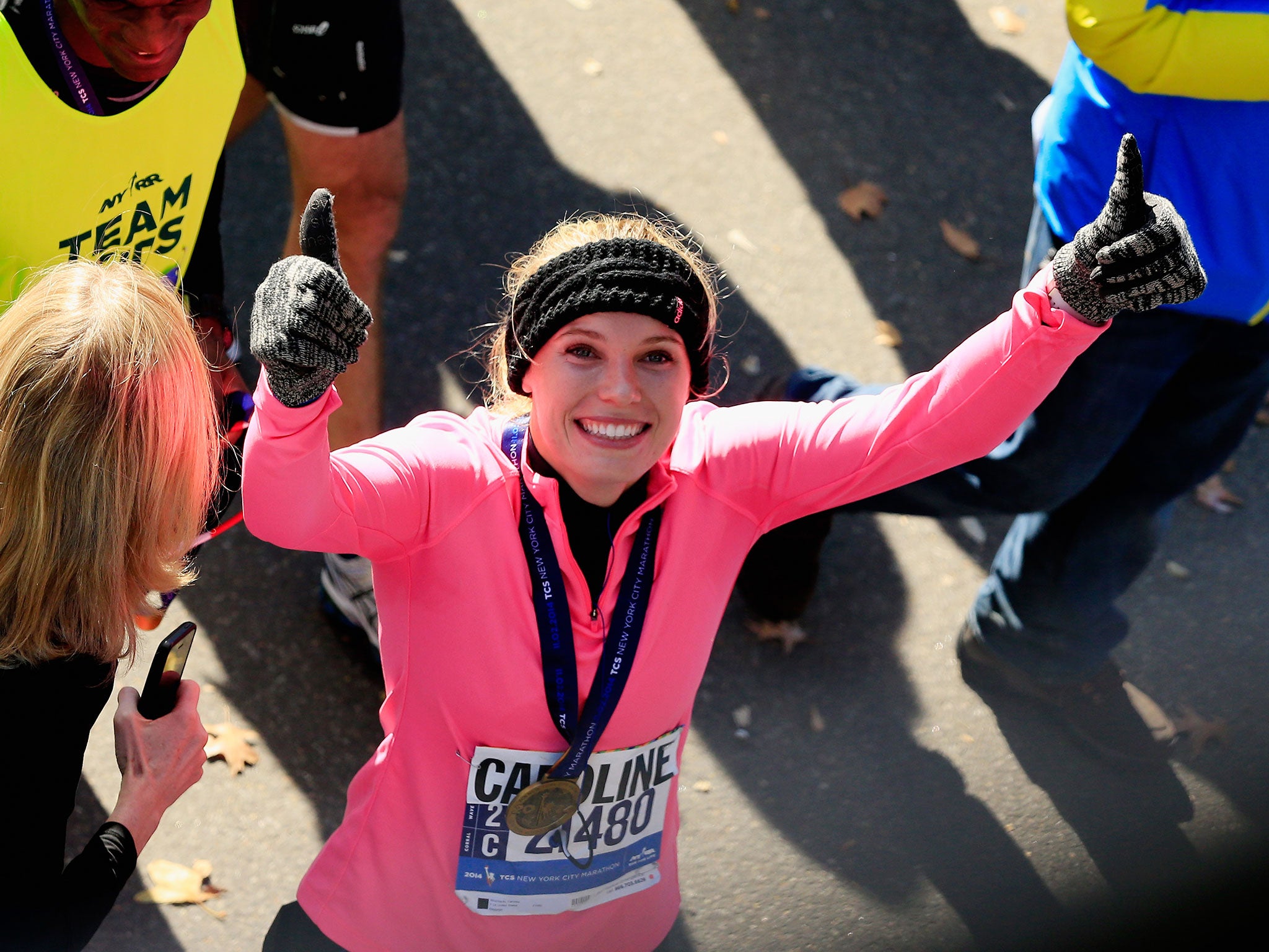 Caroline Wozniacki crosses the line of the New York City marathon