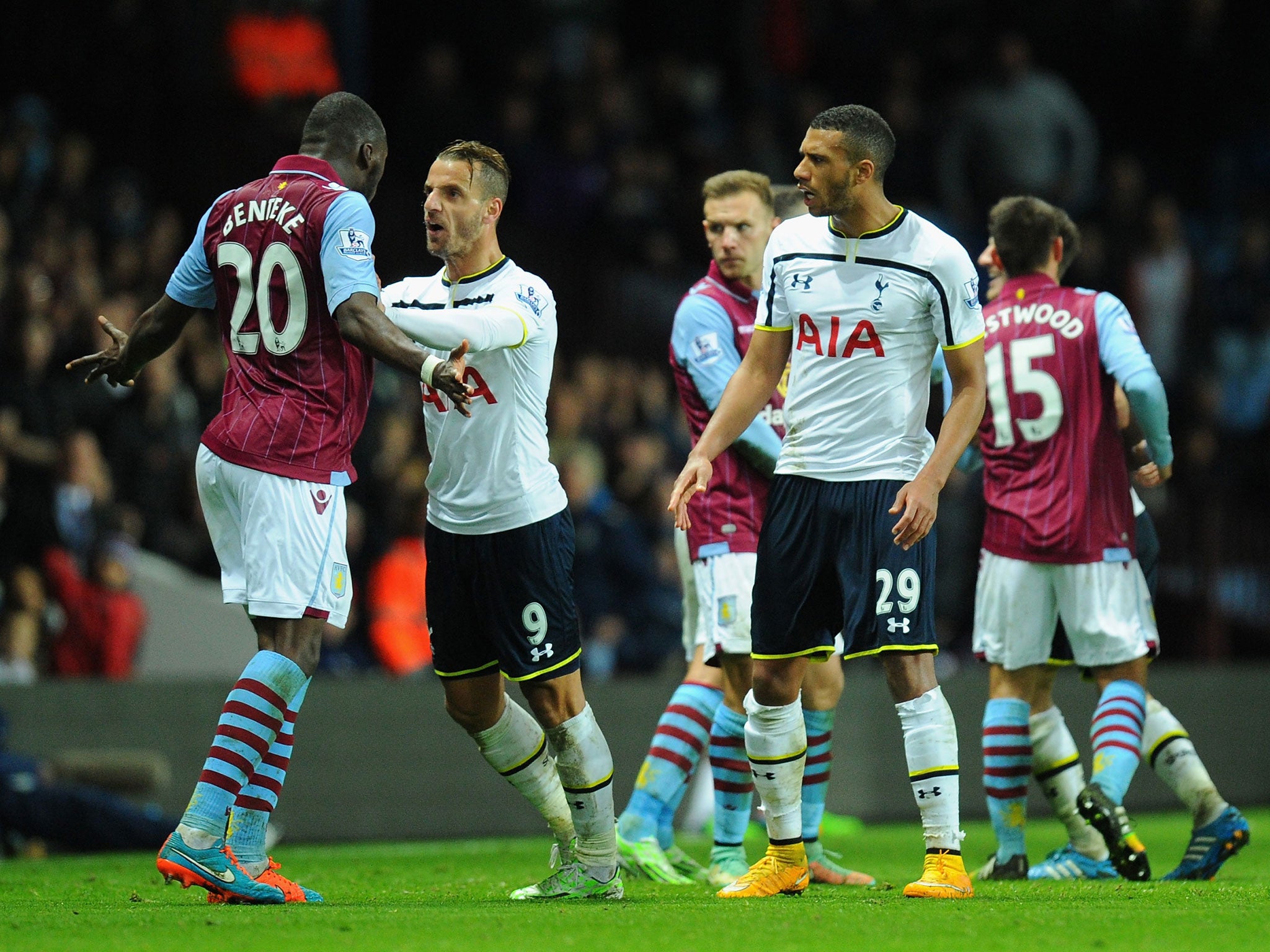 Christian Benteke is pushed by Roberto Soldado moments before he receives a red card
