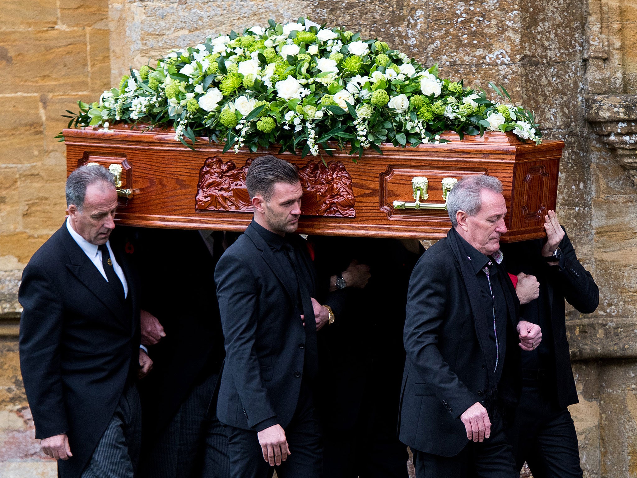 Lynda Bellinghams husband Michael Pattemore and sons carry her coffin into the church during her funeral