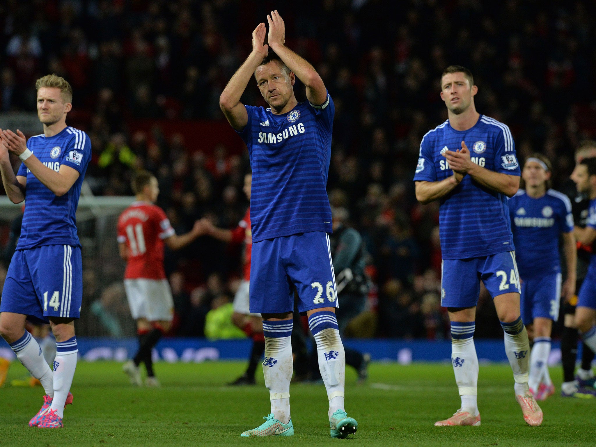 Chelsea captain John Terry applauds the crowd following the draw with Manchester United