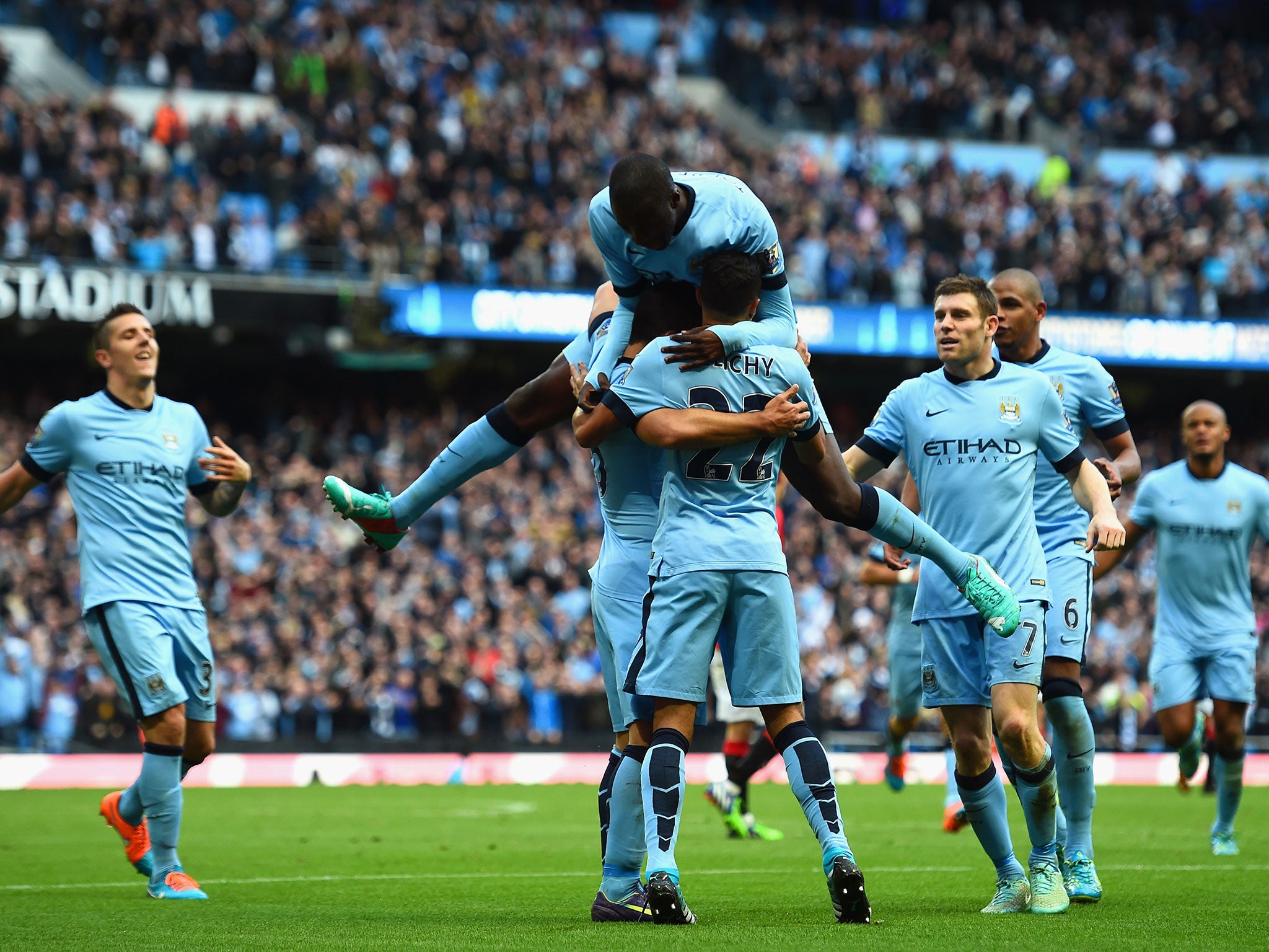 Manchester City midfielder Yaya Toure celebrates with his Manchester City team-mates
