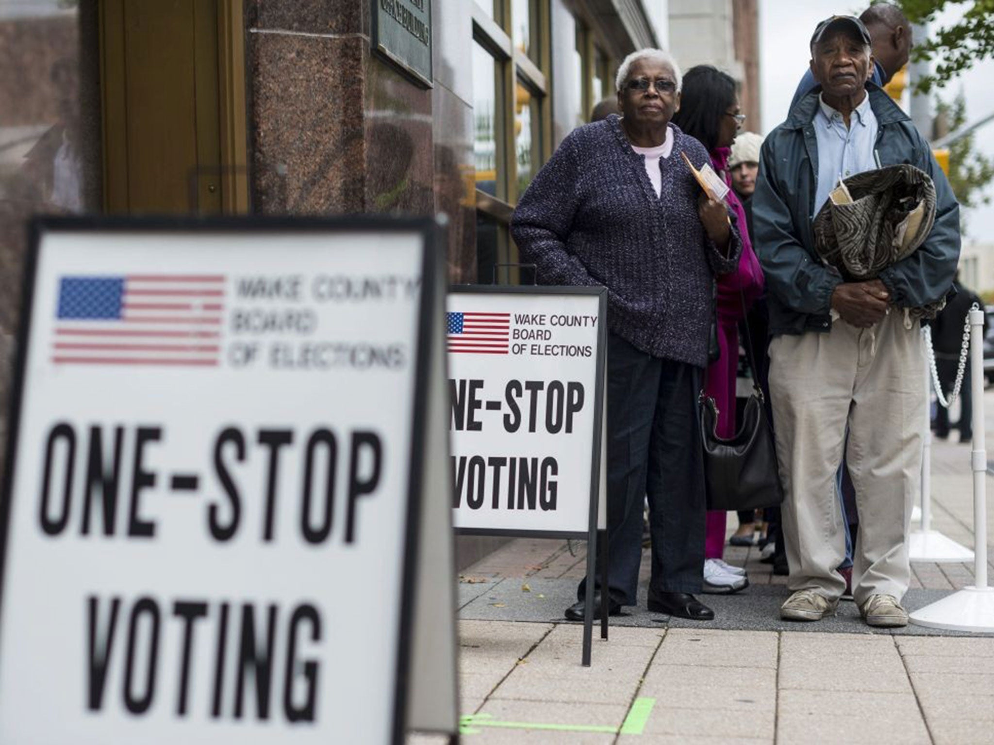 Residents stand in like to take part in the last day of early voting in Raleigh, North Carolina