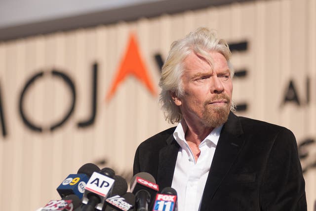 Virgin founder Sir Richard Branson speaks at a press conference at the Mojave Air and Space Port in Mojave, California on November 1, 2014.
