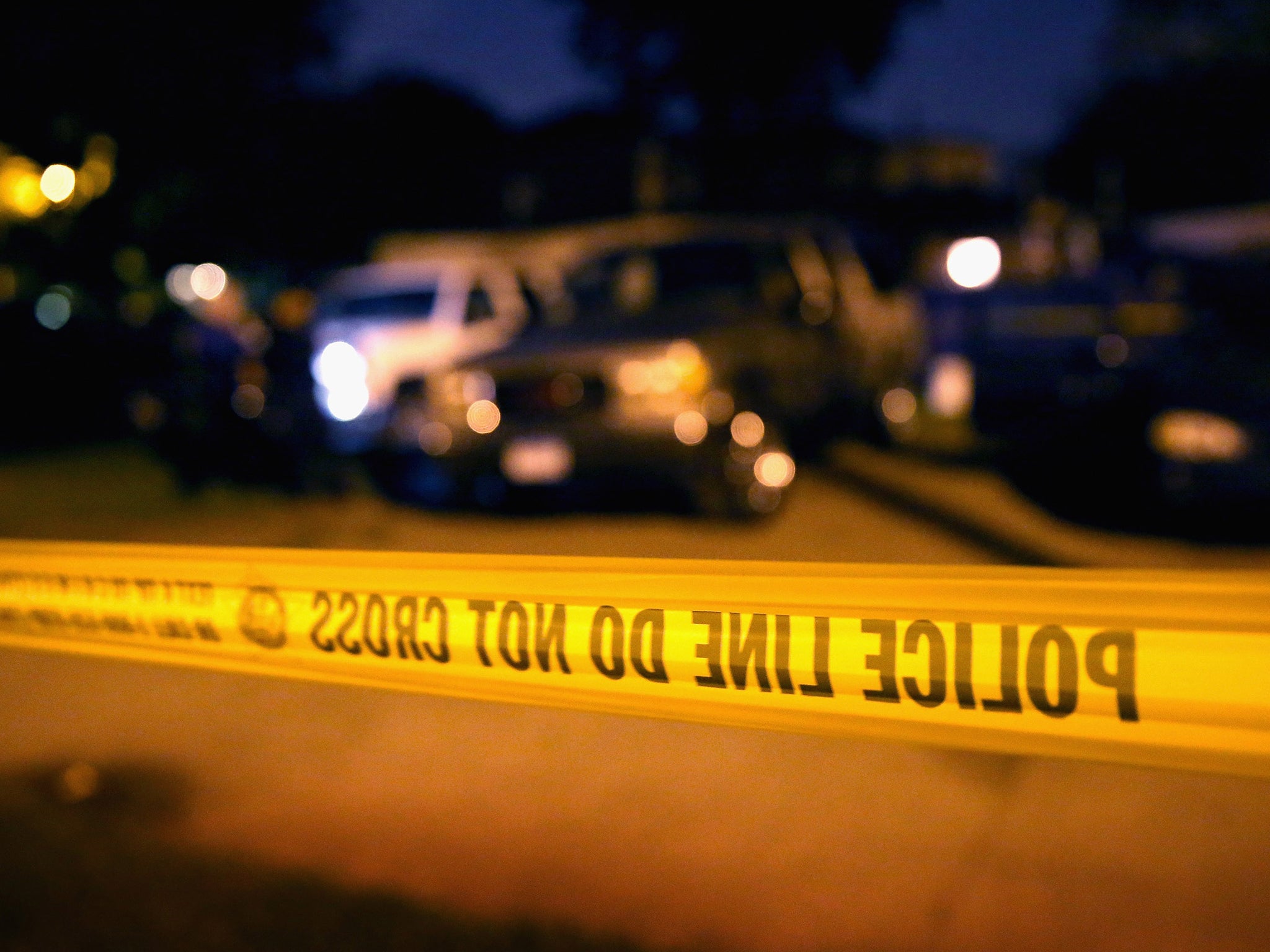 Police collect evidence at the scene of a shooting on 23 June 2013 in Chicago, Illinois