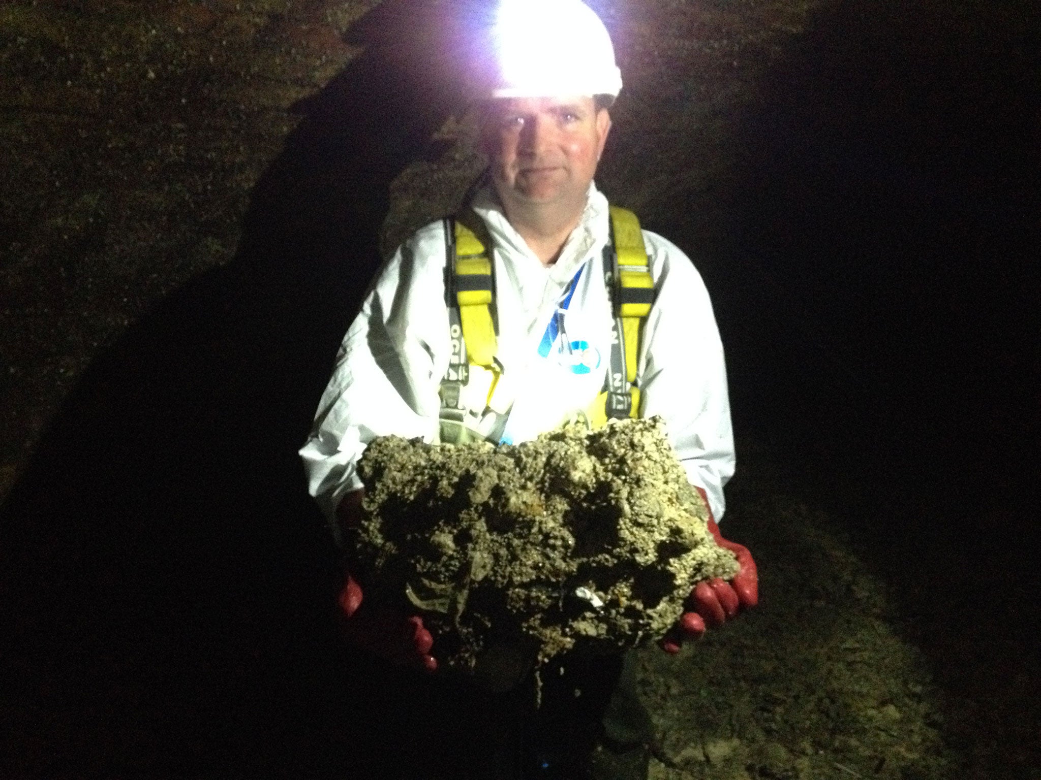 Sewer worker Tim Henderson holding a fatberg