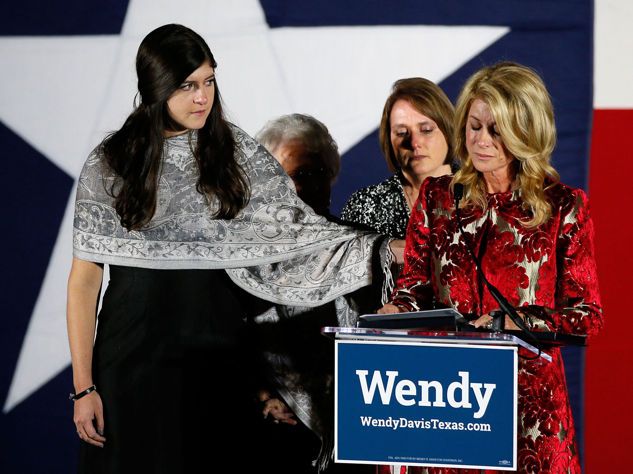Dru Davis, daughter of Texas Democratic gubernatorial candidate Wendy Davis, consoles her mother as she makes her concession speech in Fort Worth, Texas