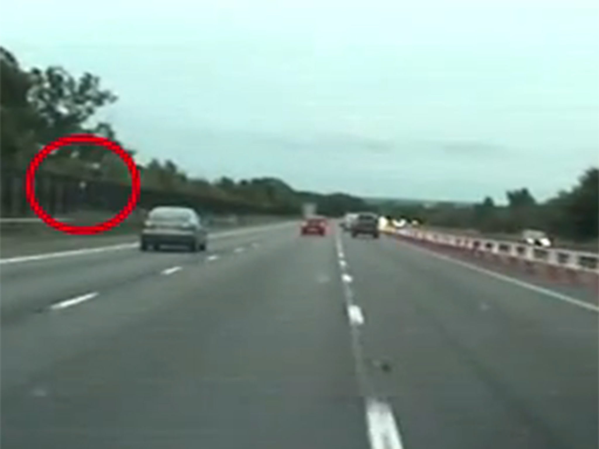 The moment a bag of heroin is thrown from the moving vehicle